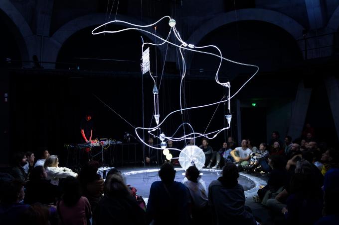 Media art performance, surrounded by audience